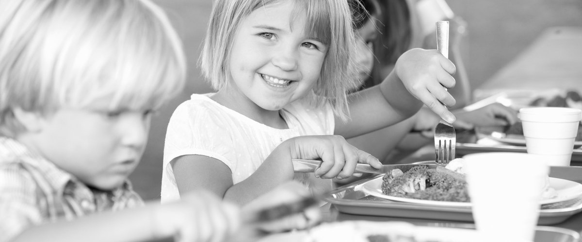 ElementaryPupilsEnjoyingHealthyLunchInCafeteria.jpg